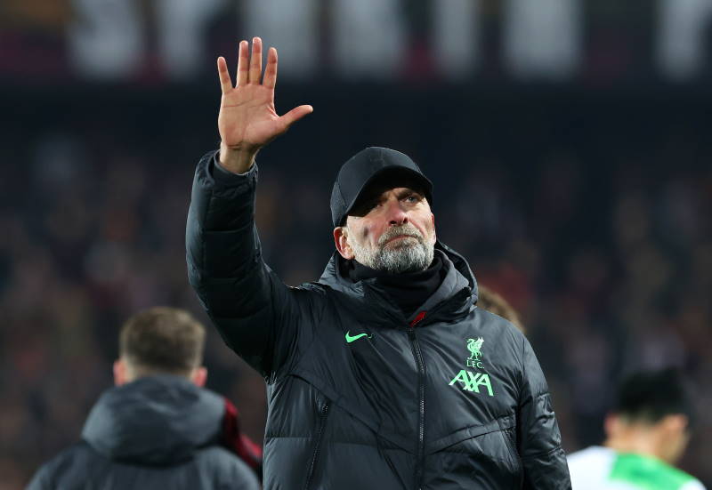 Liverpool manager Jurgen Klopp waving at fans