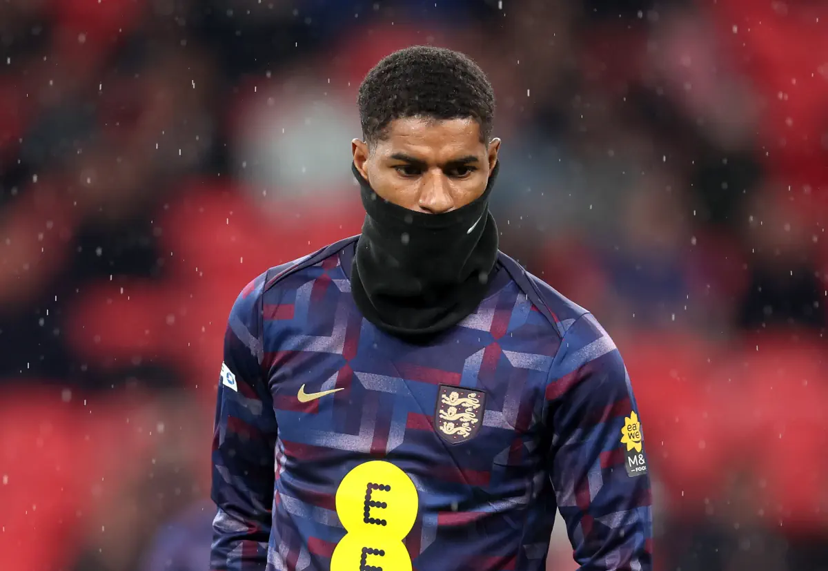 Marcus Rashford warms up for England