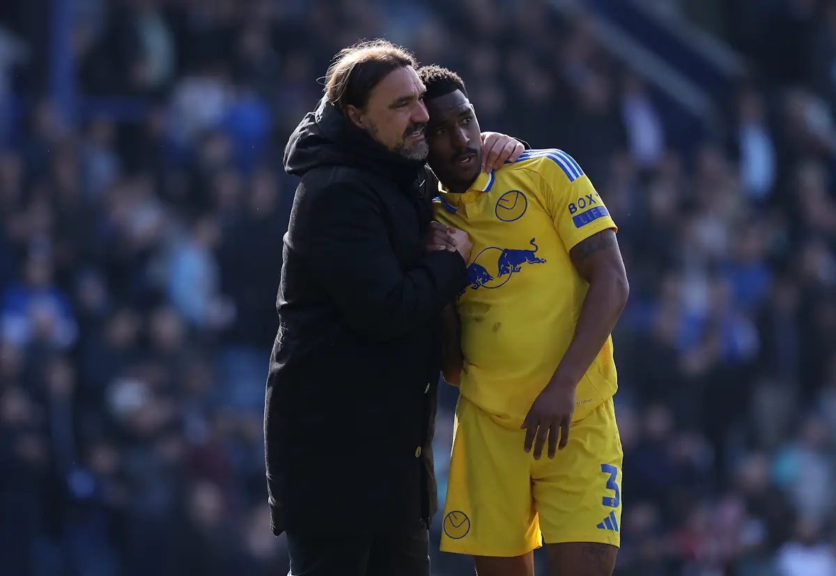 Leeds manager Daniel Farke hugs Junior Firpo