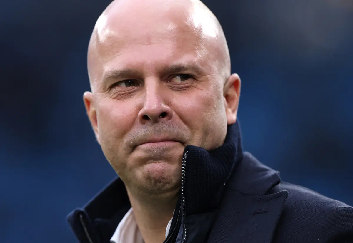 Liverpool boss Arne Slot looks on.